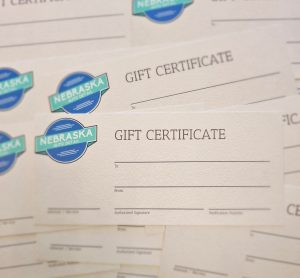 Close up of Nebraska Auto Detail paper gift certificates waiting to be filled in.